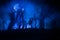 Bloodthirsty zombies attacking. hungry zombies in the woods. Silhouettes of scary zombies walking in the forest at night