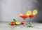 Bloody maria tomato juice smoothie and ingredients tomato, lime, celery, parsley. Strong drinks in two elegant glasses