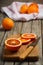 Bloody oranges on the wooden table.