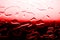 Bloody red textured background, spilled water drops in red color contrast gradient, blood test or donor illustration