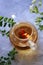 Blooming Chinese tea in glass teapot, top view