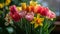 Blooming tulips, daffodils, and Easter lilies in a vibrant springtime arrangement