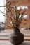 Blossom buds in a mini vase. New young leaves on the branches. Beauty of nature. Natural spring background