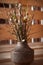 Blossom buds in a mini vase. New young leaves on the branches. Beauty of nature. Natural spring background