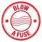BLOW A FUSE text on red round postal stamp sign