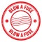 BLOW A FUSE text written on red round postal stamp sign