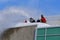 Blowing snow off a roof