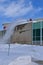 Blowing snow off a roof