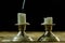 Blown candles in silver candlesticks with smoked wick. Smoke fro