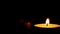 Blown out candles on dark low key background, thirty frame per second