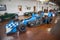 A blue 1999 Dallara “Truck Nation” IRL Car at Lane Motor Museum with the largest collection of vintage European cars