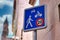 Blue 20km/h Home Zone speed limit sign showing car, bicycle and pedestrian in French street