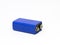 A blue 9 volt battery isolated on a white background