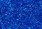 Blue abstract background. Blue glitter closeup photo. Dark blue shimmer wrapping paper.
