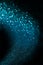 Blue abstract glitter trail background made of defocused lights