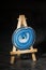 Blue agate slices on a miniature easel with copy space