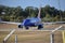 Blue aircraft with yellow and red empennage lining up on the runway at T.F. Green Airport