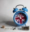 blue alarm clock with england flag dial.