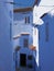 Blue alley in Chefchaouen city in Morocco - vertical