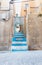 Blue alleyway steps leading up to next street Alicante Spain street and building scene