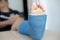 Blue ankle and foot splint Bandages on the legs from a young man`s fall accident