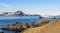 Blue antarctic cruise ship in the lagoon and Gentoo penguins col