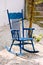 Blue antique rocking chairs on stone porch