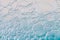 Blue aquamarine color foam bubbles from liquid soap macro wallpaper or background