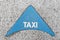 Blue arrow with the inscription Taxi