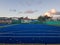 Blue artificial turf hockey court lies vacant and empty