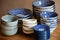 Blue asian traditional tableware, bowls, plates, on the wooden table, side view