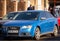 Blue Audi car in traffic, driver looking for empty parking lot in Targoviste, Romania, 2020