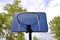 Blue backboard and rim in outdoor basketball