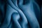 Blue background abstract cloth wavy folds of textile texture