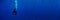 Blue background banner with a scuba diver entering water in a vertical position making bubbles with sun rays