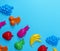 Blue background with childrens colorful toys