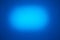 On a blue background, a light blue oval cloud of light