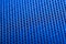 Blue background. Mesh fabric texture. Macro