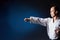 On a blue background, a young athlete performs a punch arm