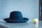 Blue bailey hat and candle, light blue background with Generative AI