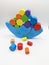 Blue balance toy with colored cilinders