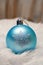 Blue ball christmas ornament with snow image