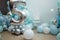 Blue balloons for boy happy birthday party. Number 5 for five years old child. Festive decorative elements, photo zone with star.