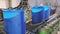 Blue barrels on an automated line in a factory. The process of colorization in the factory