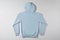 Blue basic hoodie on a grey background