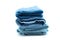 Blue bath towels pile on white background
