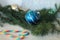 Blue bauble on christmas tree and candy canes