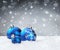 Blue baubles on snow