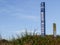 Blue beach access post in sand dunes