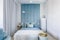 Blue bedroom with upholstered wall